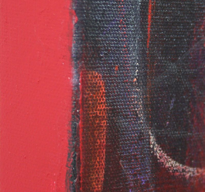 The edge of a red abstract painting
