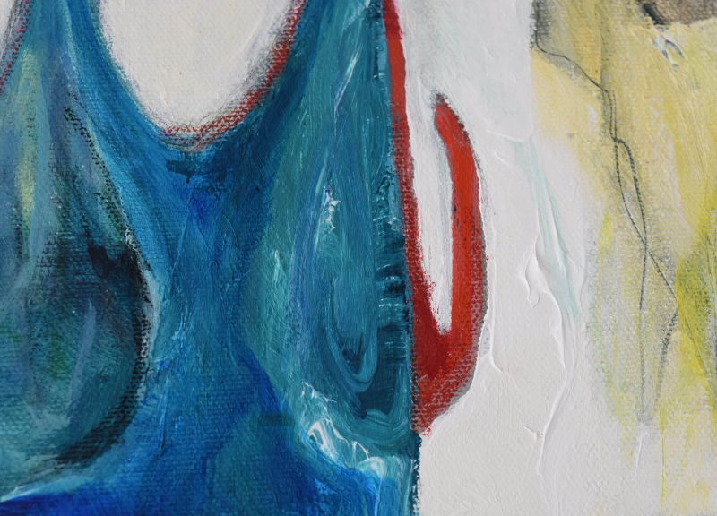 Close up of The Great Voyage, a mixed media abstract painting by Kat Gruber. There is a large blue shape with a red hook like shape coming out of the right edge. The background is white with a bit of light yellow on the right side.