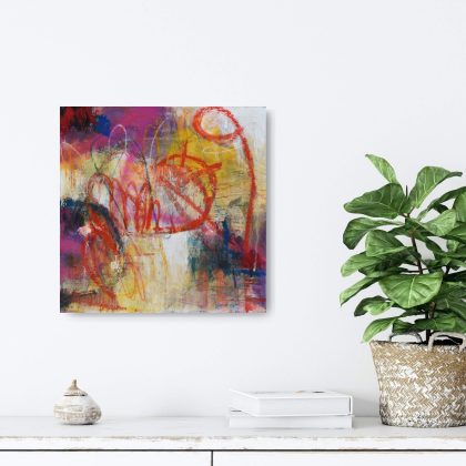 Insitu image of "Bold", a highly expressive abstract artwork by Kathryn Gruber, set against a white wall with a shelf underneath and a green fiddle leaf fig plant to the right in a pot