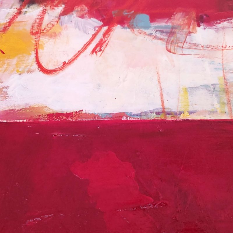 Close up of vibrant contemporary abstract painting "Heart and Soul" by Kathryn Gruber showing horizon line with texture and loose paint strokes on top and various shades of red below. The painting has a high gloss UV varnish.