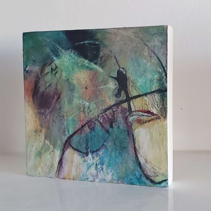 A side view of the mini shelf painting 'The Cosmic Dance' by Kathryn Gruber